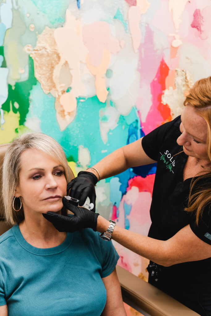 Aesthetic services being performed during Indianapolis brand photoshoot